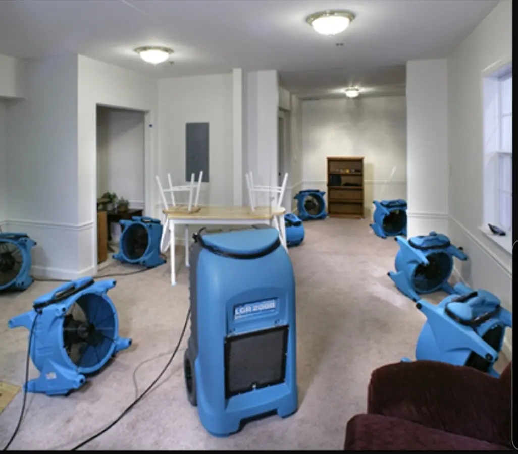 Air movers and dehumidifier setup for Water Damage Restoration in Bolivar